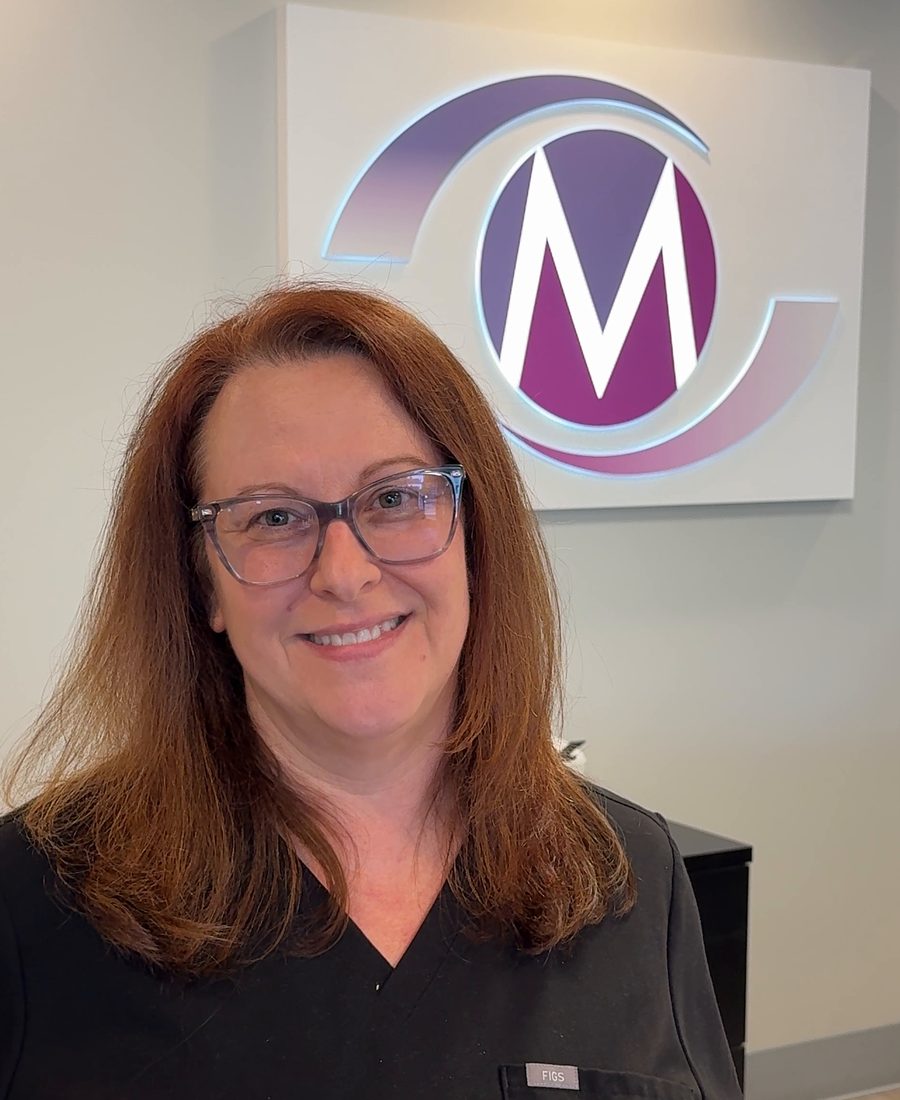 Dr. Rebecca Verna at the Modern Optometry front desk