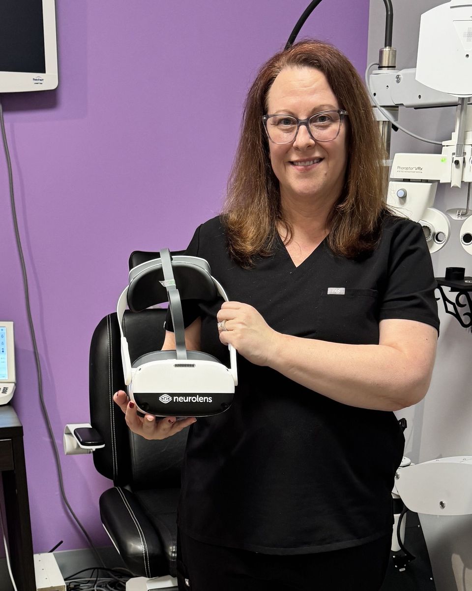 Dr. Verna holding the Neurolens device